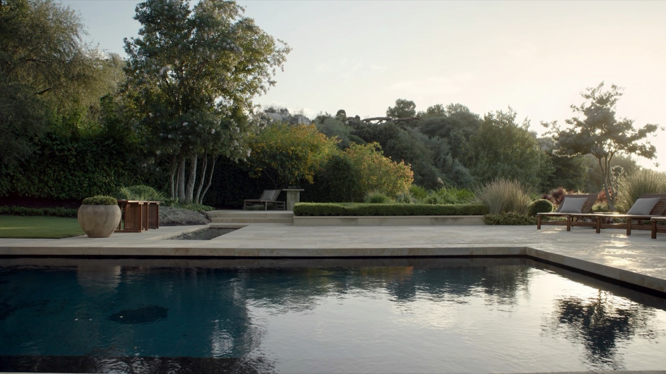 Backyard pool with natural stone coping